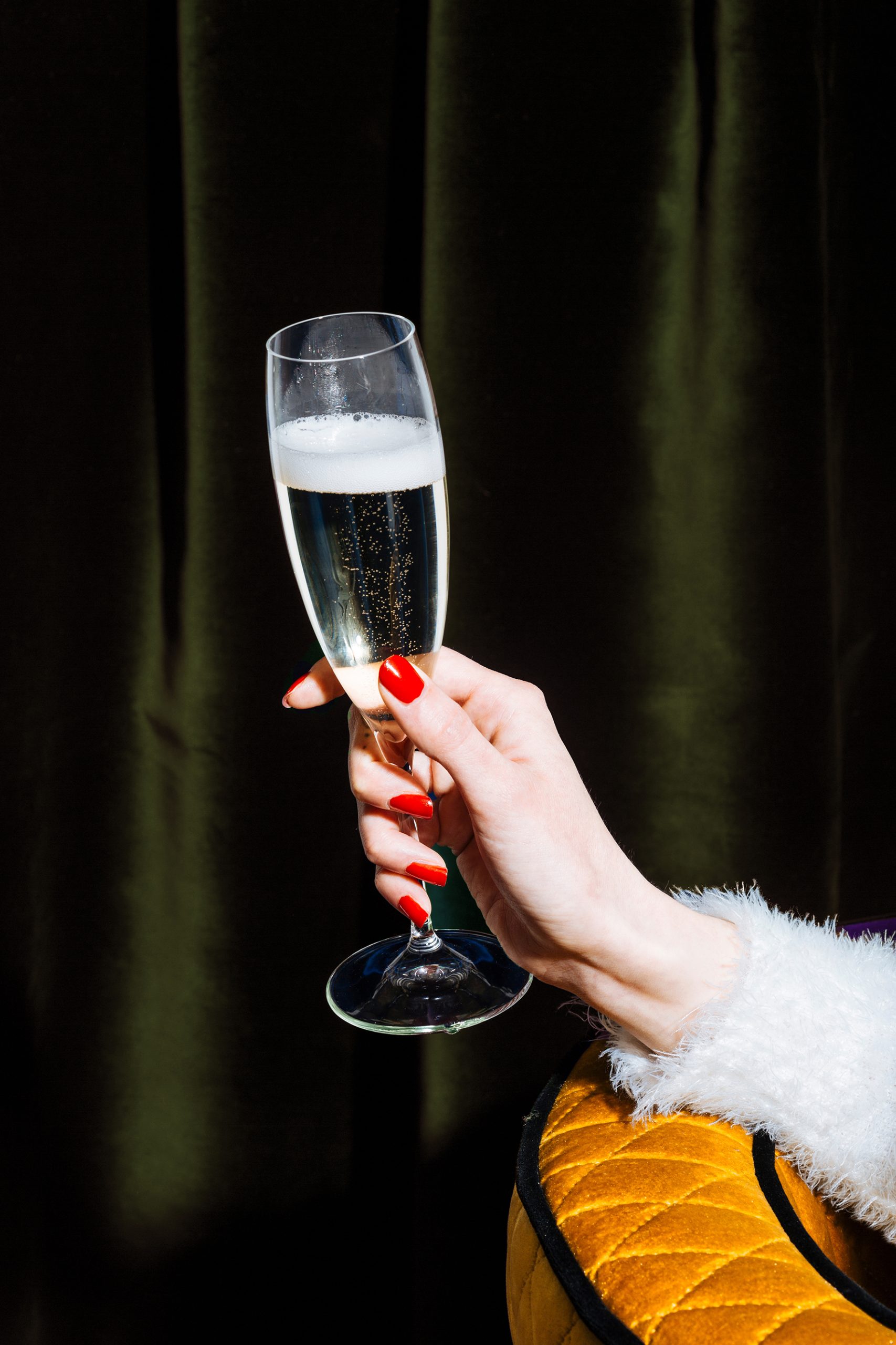 Glass of sparkling Prosecco di Conegliano-Valdobbiadene, held by